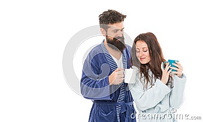 Man and woman wear bathrobes hold tea mug or coffee cup. Caffeine power concept. With coffee morning tastes better Stock Photo