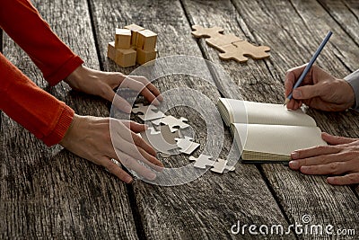 Man and woman working on assignment trying to find solution to a Stock Photo