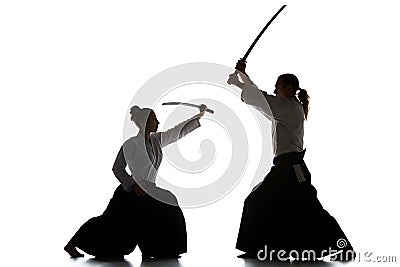 Man and woman fighting and training aikido on white studio background Stock Photo