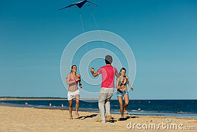 Man and women playing boule on beach Stock Photo