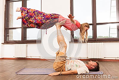 Man and woman practicing partner yoga Stock Photo