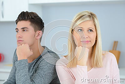 Man and woman with their chins on their hands Stock Photo