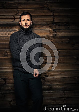 Man in wooden rural house interior Stock Photo