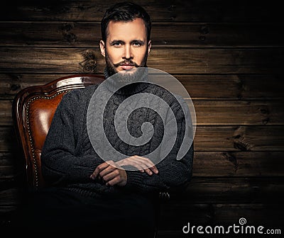 Man in wooden rural house interior Stock Photo