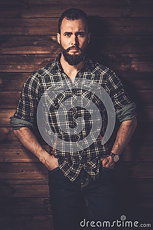 Man in wooden rural house interior Stock Photo