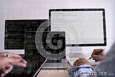 Man work Coding software developer programmer is coding on a desktop computer Stock Photo