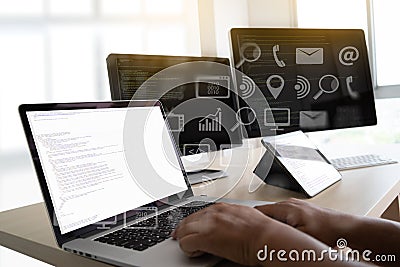 man work Coding software developer programmer is coding on a desktop computer Stock Photo