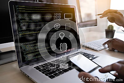 Man work Coding software developer programmer is coding on a desktop computer Stock Photo