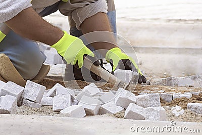 Man at work, street worker, paving Stock Photo