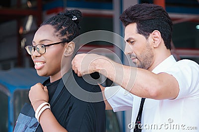 Man work with woman, they are good friendship. Diversity of two people, caucasian business manager has good friendship with Stock Photo