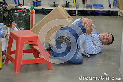 Man worker with knee injury concept accident at work Stock Photo