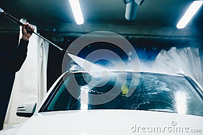 Man working a car wash close up car cleans Stock Photo