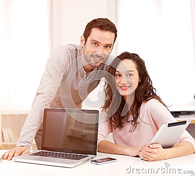 Man working with his co-worker on computer