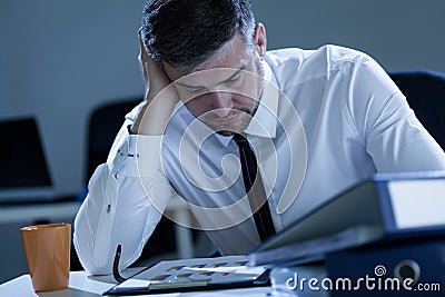 Man working late at the office Stock Photo