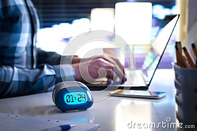 Man working late. Workaholic or being behind schedule concept. Stock Photo
