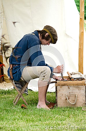 Man working with old tools Editorial Stock Photo