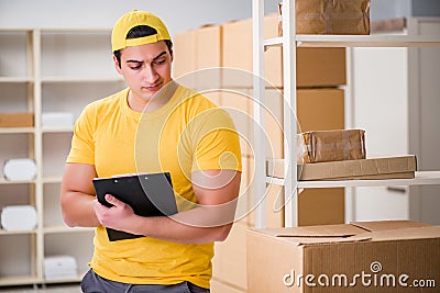 The man working in postal parcel delivery service office Stock Photo