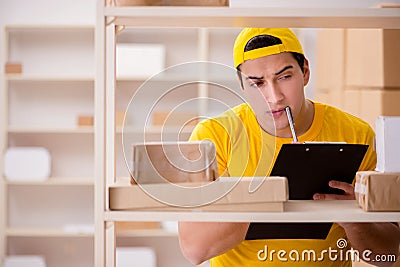 The man working in postal parcel delivery service office Stock Photo