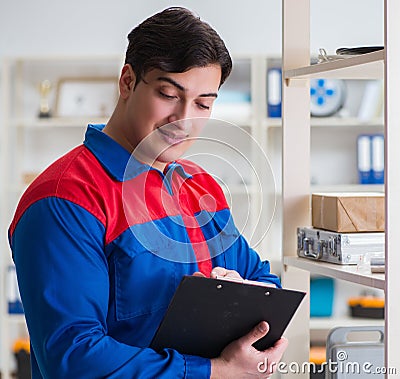 Man working in the postal warehouse Stock Photo