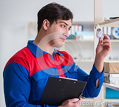 Man working in the postal warehouse Stock Photo