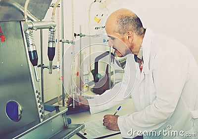 Man working with quality tests Stock Photo