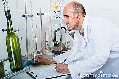 Man working with quality tests Stock Photo