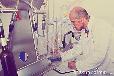 Man working with quality tests Stock Photo