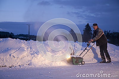 Man working with snow plough Stock Photo