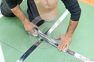 Man working with underlayment Stock Photo