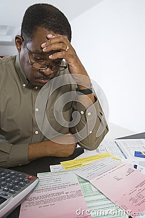 Man Worrying About Home Finances Stock Photo