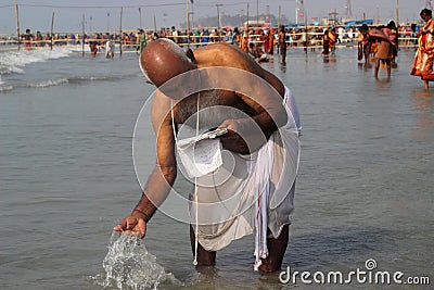 A man is worshiping the Ganga. Editorial Stock Photo