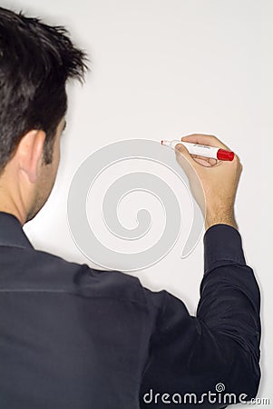 Man writing on dry erase board Stock Photo