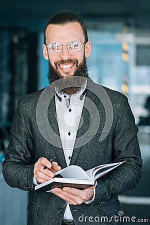 Man writing info notebook records data analysis Stock Photo