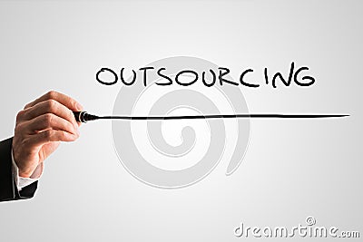 Man writing the word Outsourcing Stock Photo