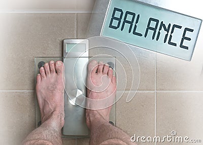 Man& x27;s feet on weight scale - Balance Stock Photo