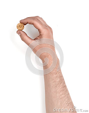 Man's hand holding a coin isolated on white background Stock Photo