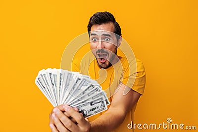 Man yellow finance happy hand dollar currency business cash smiling money rich background Stock Photo