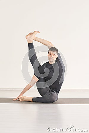 Man in yoga asana. Home studio. One person Stock Photo