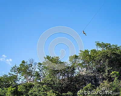 Man ziplining in the Mexican jungle Stock Photo