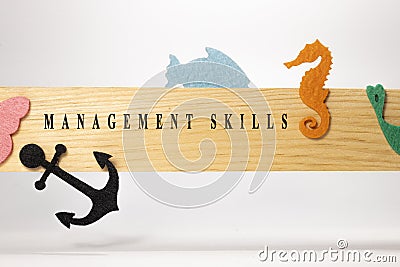 Management skills written on a wooden patterned surface. Education and child psychology Stock Photo
