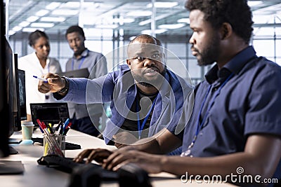 Server hub supervisor scolding worker unable to properly optimize code Stock Photo