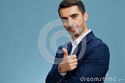 manager blue suit showing thumb emotions business and office concept Stock Photo