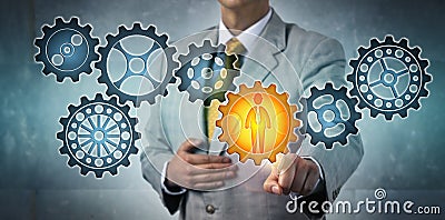 Manager Choosing Male Engineer Icon In Gear Train Stock Photo