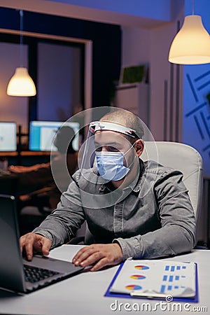 Manager and colleagues doing overtime Stock Photo