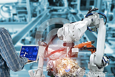 Manager engineer check control automation Robotic arms, industrial robots factory automation machines Stock Photo