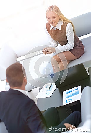 Manager Finance in addressing the financial schedules in the lob Stock Photo
