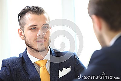 Manager listening to his colleague explanations Stock Photo