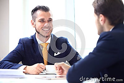 Manager listening to his colleague explanations Stock Photo
