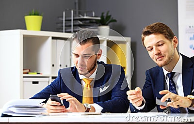 Manager listening to his colleague explanations Stock Photo