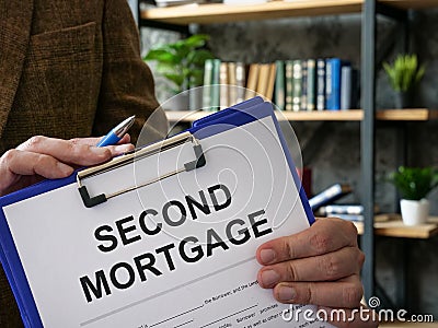 The manager offers a second mortgage documents to be signed. Stock Photo